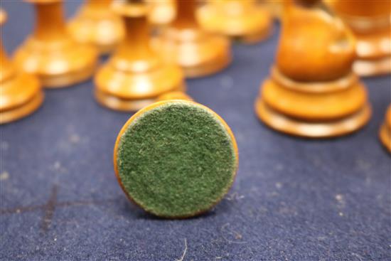 A Jaques Staunton boxwood and ebony chess set, knights and rooks stamped with a crown and the white king kings 8.5cm